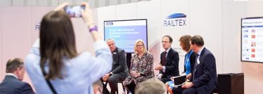 A visitor records a conference at Railtex